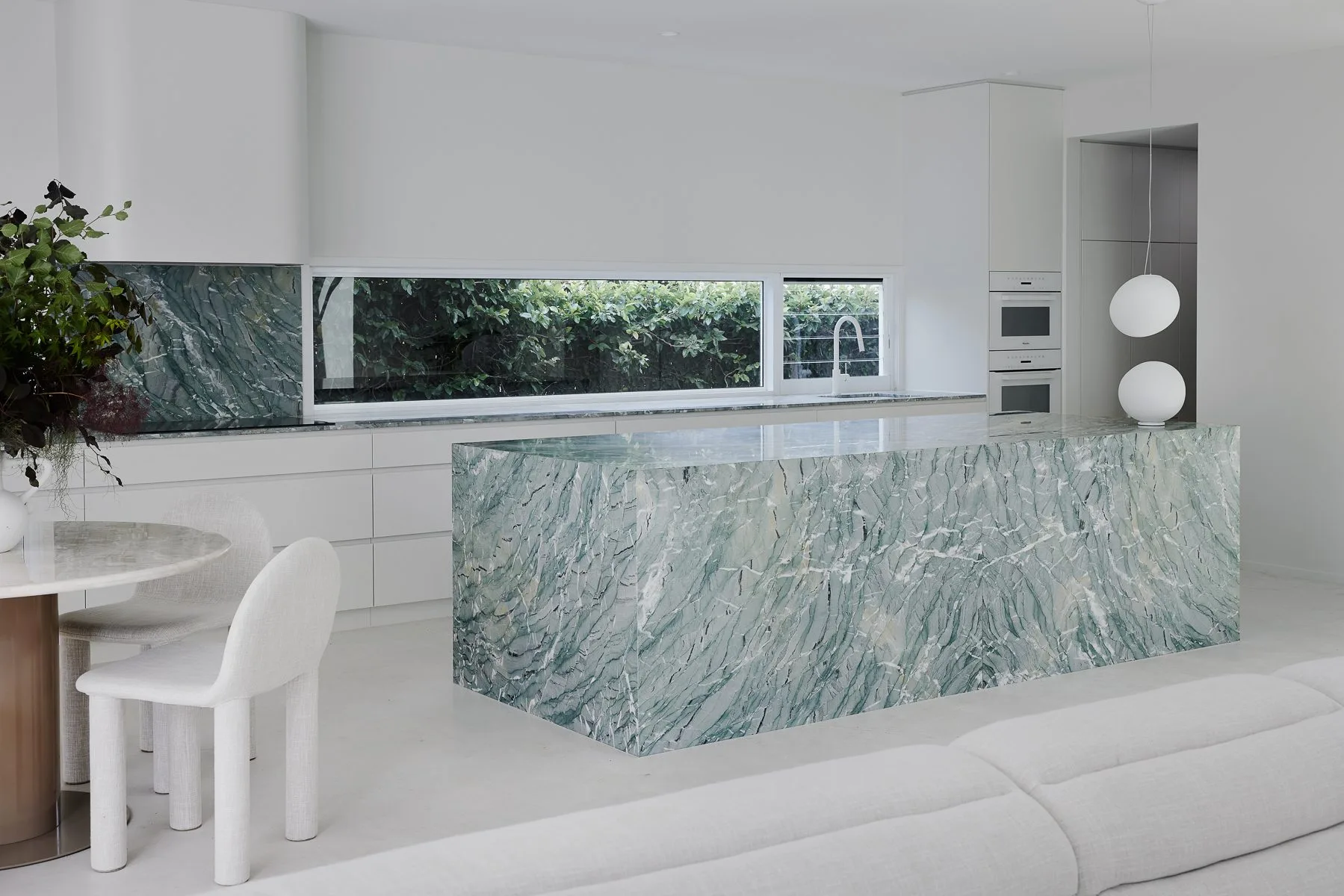 Kitchen with a green marble island, II House